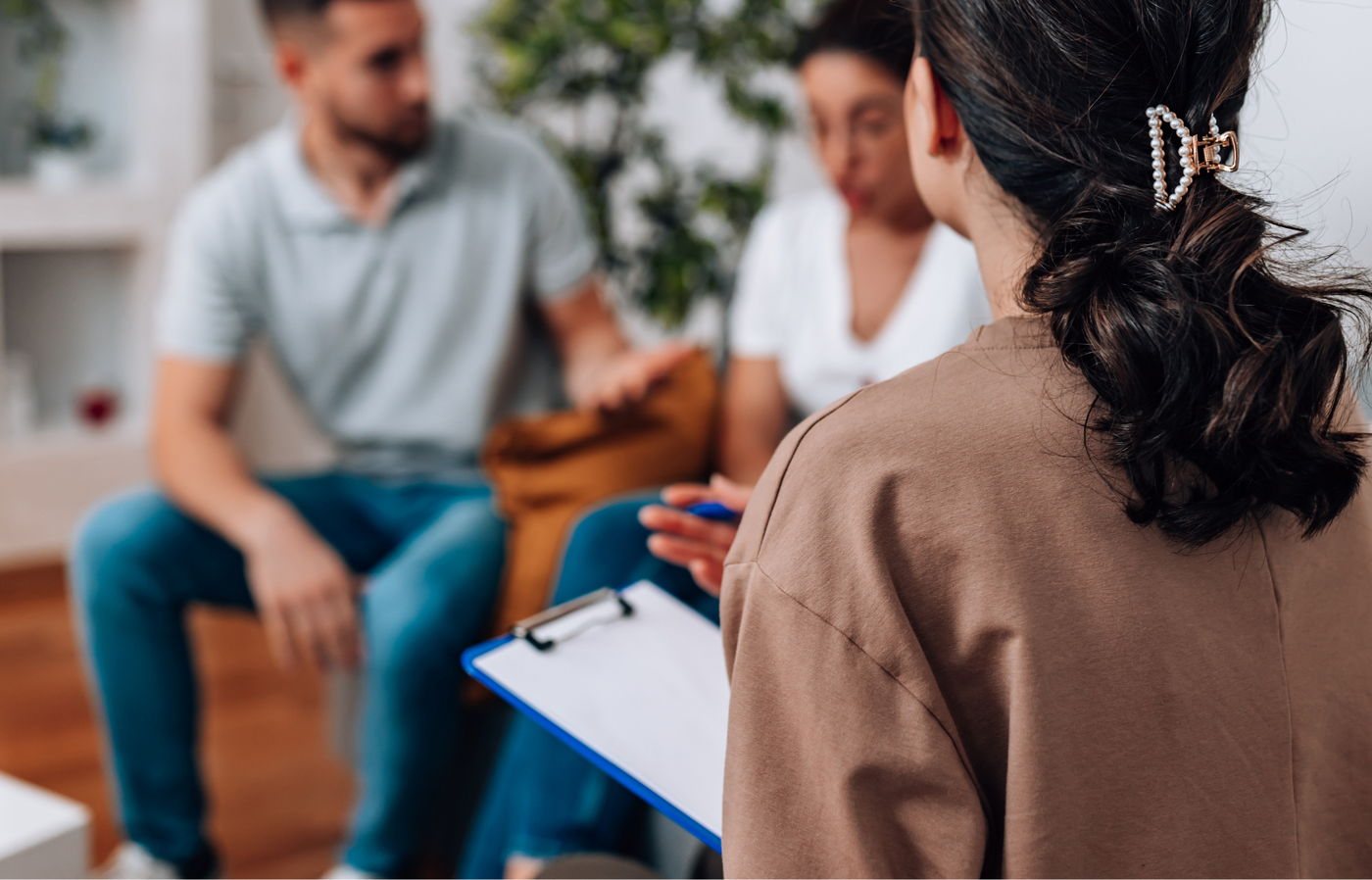Two people in a counseling session with a counselor