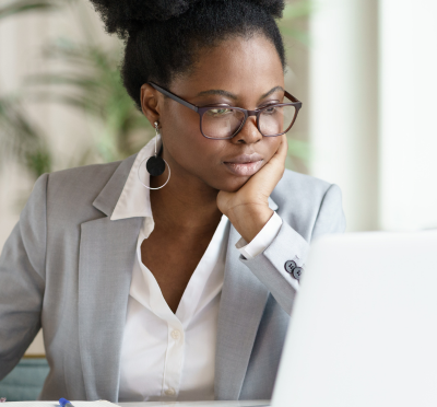 A woman working on a laptop in the workplace 