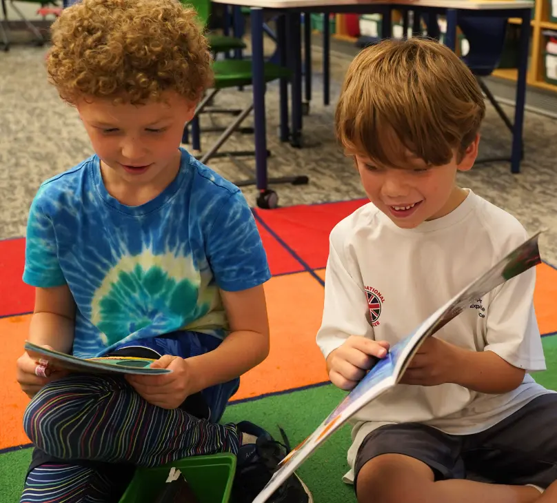 Two elementary students reading